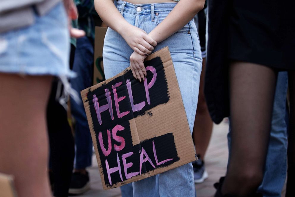 PHOTO: A university student holds a sign during a rally demanding better counseling and mental health services for all students on Dec. 2, 2021, in Santa Clara, Calif. PHOTO: A university student holds a sign during a rally demanding better counseling and mental health services for all students on Dec. 2, 2021, in Santa Clara, Calif.